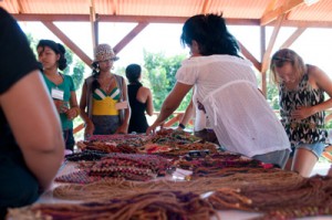 Tumbira school head master Izolena buying handcrafts from the sales table